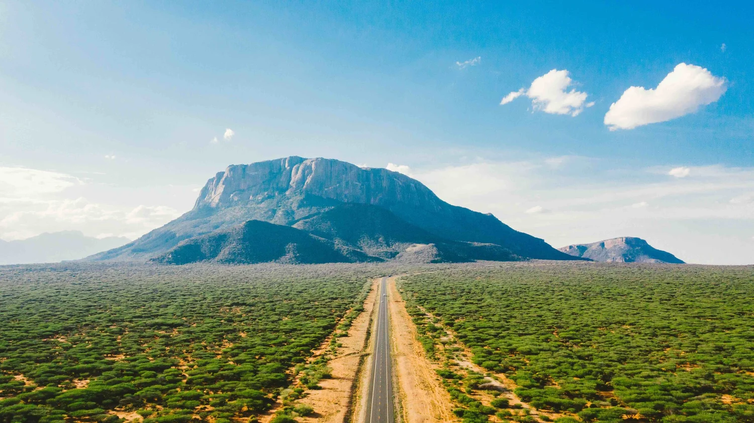 Open road toward a mountain, Northern Kenya